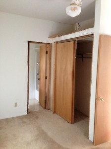 First floor bedroom looking to closet and bathroom door.