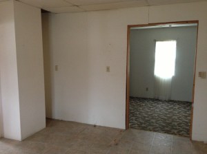 Another view of the kitchen wall, bulkhead, and into the laundry.