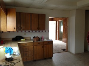 Kitchen toward living room and front door.