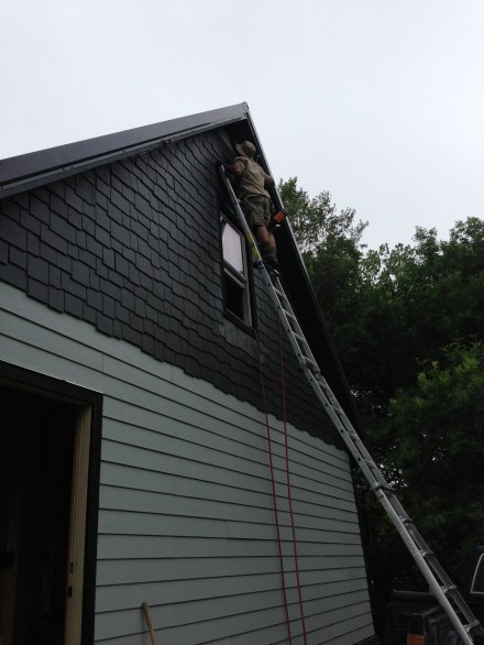 Ben installs the very last piece. Our ladder is just barely tall enough...and its standing in the bed of the truck!